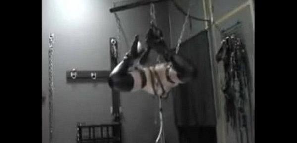  suspended slave girl in rubber